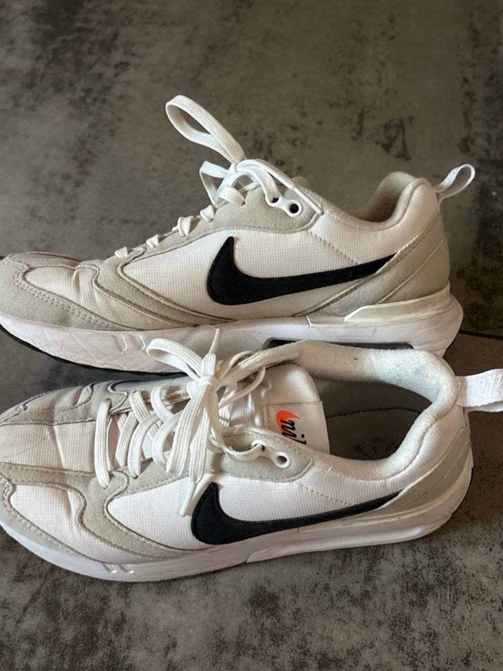 Nike Women's White Casual Sneakers with Black Swoosh
